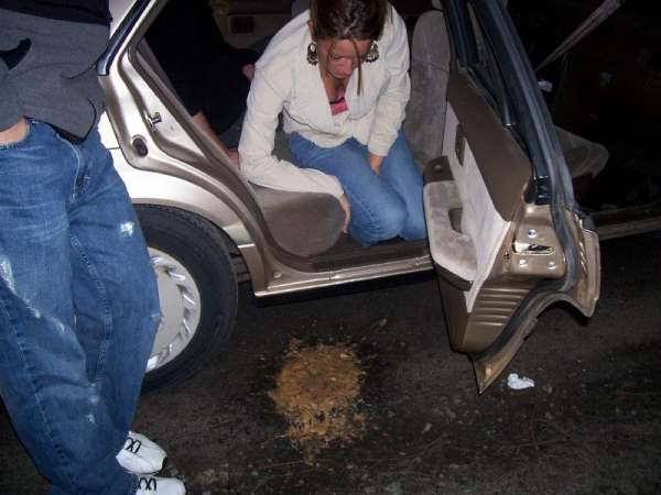 Girl had to much fun in the car....!! vomit
