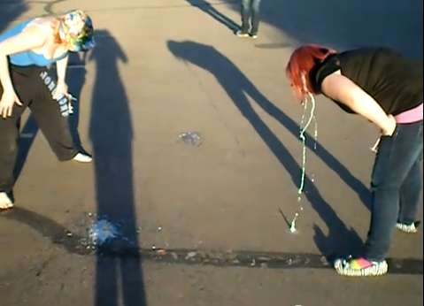 Chubby Monica and friend puke in a parking lot vomit