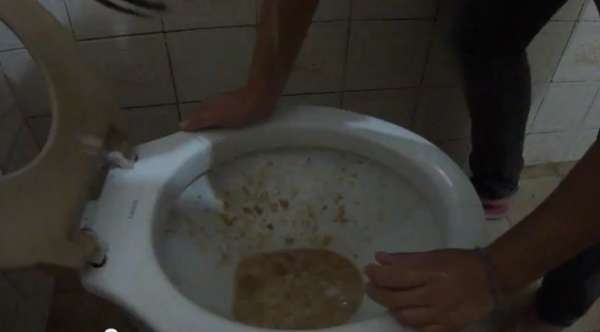 Puking all over the toilet vomit