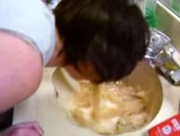 Puking in a seashell shaped sink vomit