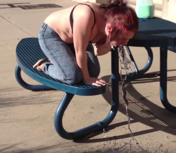 Kneeling to puke purple vomit