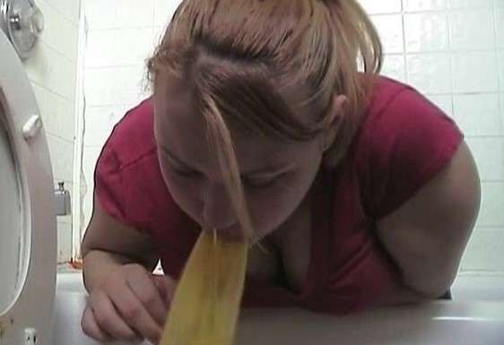 Heather kneels in the tub and barfs in the toilet vomit
