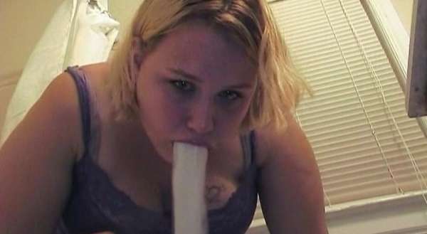 Heather looks right at the camera while she vomits vomit