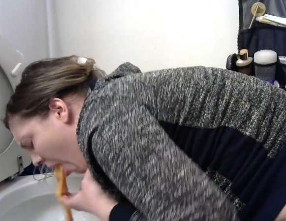 Nice looking girl pukes in toilet vomit