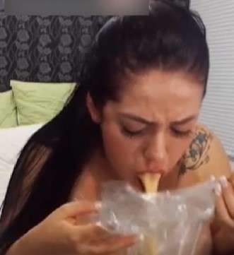 Katy pukes in a bag vomit