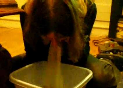 Gina pukes in a tub vomit