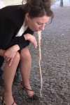 Stylish lady voms on cobblestone vomit