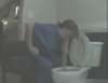 Sitting next to the toilet vomit