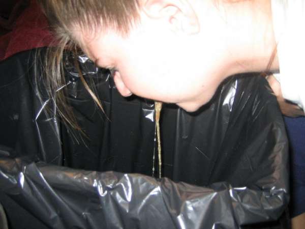Girl puking milk vomit