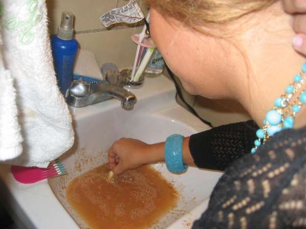 She playing with her vomit! vomit